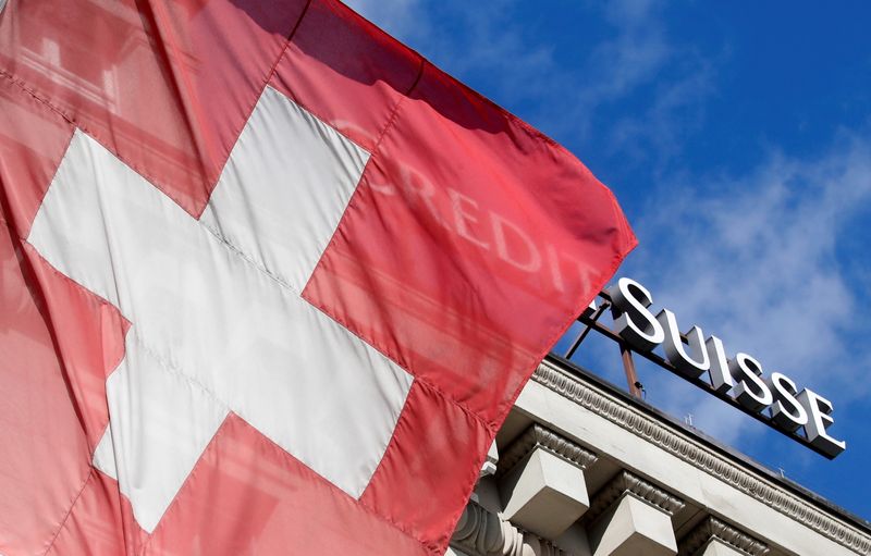 &copy; Reuters. FILE PHOTO: Switzerland's national flag flies in front of the logo of Swiss bank Credit Suisse in Luzern, Switzerland February 5, 2020. REUTERS/Arnd Wiegmann/File Photo