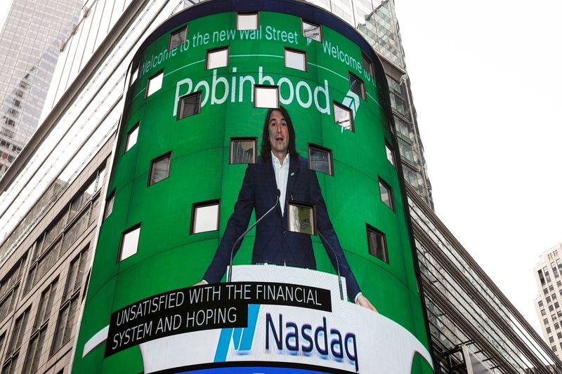 © Reuters. Vlad Tenev, CEO and co-founder Robinhood Markets, Inc., is displayed on a screen during his company’s IPO at the Nasdaq Market site in Times Square in New York City, U.S., July 29, 2021.  REUTERS/Brendan McDermid