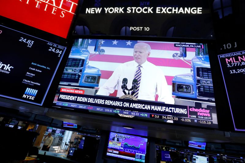 &copy; Reuters. A screen displays the U.S. President Joe Biden's remarks on American manufacturing on the trading floor at New York Stock Exchange (NYSE) in New York City, New York, U.S., July 28, 2021. REUTERS/Andrew Kelly