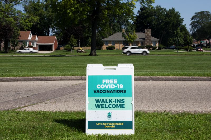 &copy; Reuters. FILE PHOTO: A sign is seen notifying the public that coronavirus disease (COVID-19) vaccines are available for walk-ins at a mobile pop-up vaccination clinic hosted by the Detroit Health Department with the Detroit Public Schools Community District at Ren