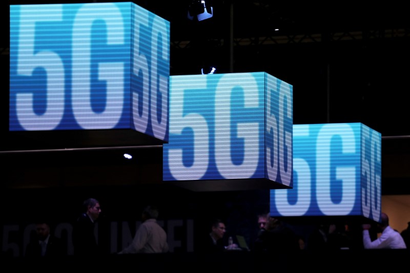 &copy; Reuters. FILE PHOTO: Hanging cubes display 5G logos at the Mobile World Congress in Barcelona, Spain, February 26, 2019. REUTERS/Sergio Perez/File Photo
