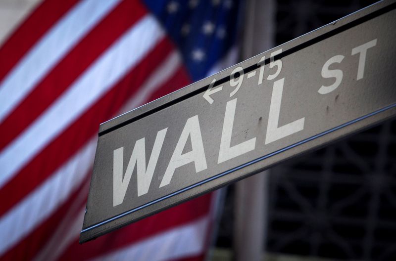 &copy; Reuters. FILE PHOTO: A Wall Street sign is pictured outside the New York Stock Exchange in New York, October 28, 2013.  REUTERS/Carlo Allegri