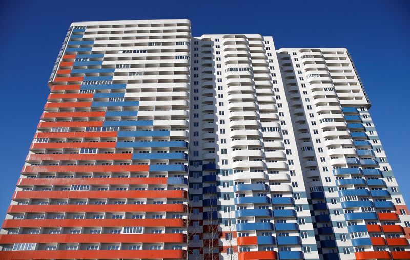 &copy; Reuters. A general view shows a new apartment block with a facade, depicting the colours of the Russian state flag, in Saint Petersburg, Russia March 24, 2019. REUTERS/Anton Vaganov