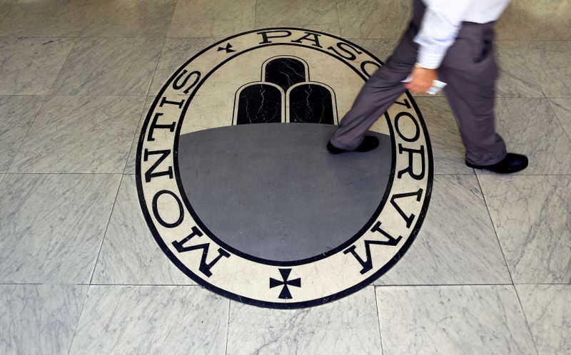 &copy; Reuters. FILE PHOTO: A man walks across the logo of the Monte dei Paschi di Siena bank in Rome, Italy, September 24, 2013. REUTERS/Alessandro Bianchi/File Photo
