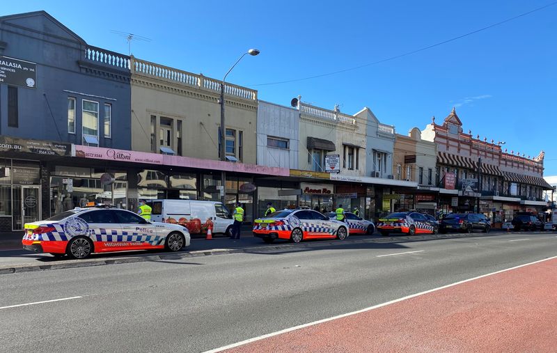 COVID-19 cases surge in Sydney as police cordon deters protest