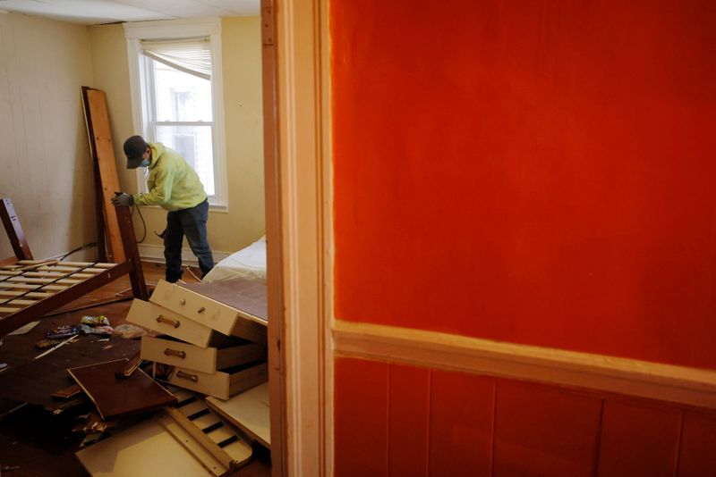 &copy; Reuters. FILE PHOTO: Workers break up the furniture left by a renter who was evicted after a 48-hours notice for violating the terms of her lease in Chelsea, Massachusetts, U.S., March 29, 2021. REUTERS/Brian Snyder