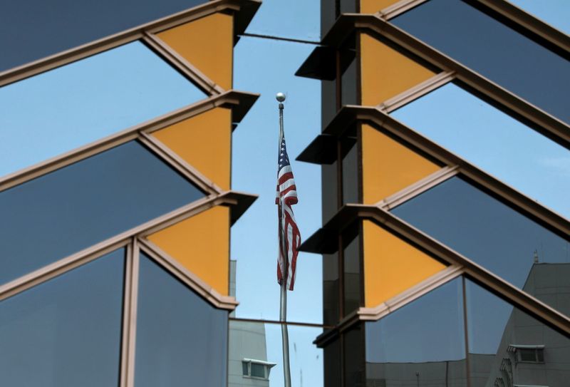 &copy; Reuters. FILE PHOTO: The U.S. flag is reflected on the windows of the U.S. Embassy in Kabul, Afghanistan July 30, 2021. REUTERS/Stringer
