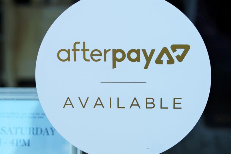 © Reuters. FILE PHOTO: A logo for the company Afterpay is seen in a store window in Sydney, Australia, July 9, 2020. REUTERS/Stephen Coates/File Photo