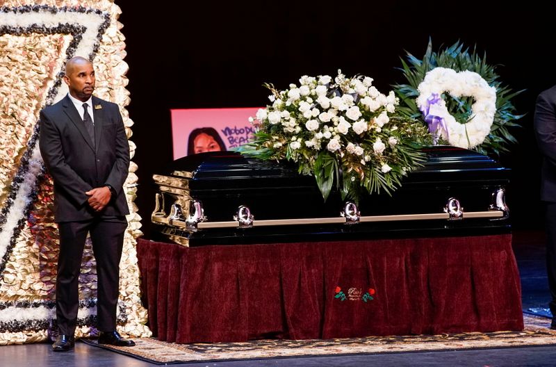 &copy; Reuters. A man stands guard next to the casket for late rapper Marcel Theo Hall, known by his stage name Biz Markie, during the funeral service in Patchogue, New York, U.S., August 2, 2021. REUTERS/Eduardo Munoz