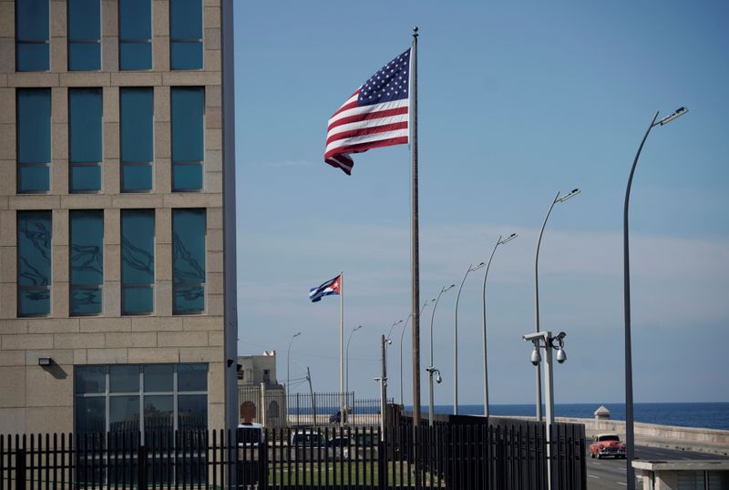 &copy; Reuters. FILE PHOTO: A view of Cuban and U.S. flags beside the U.S. Embassy in Havana, Cuba, December 15, 2020. REUTERS/Alexandre Meneghini