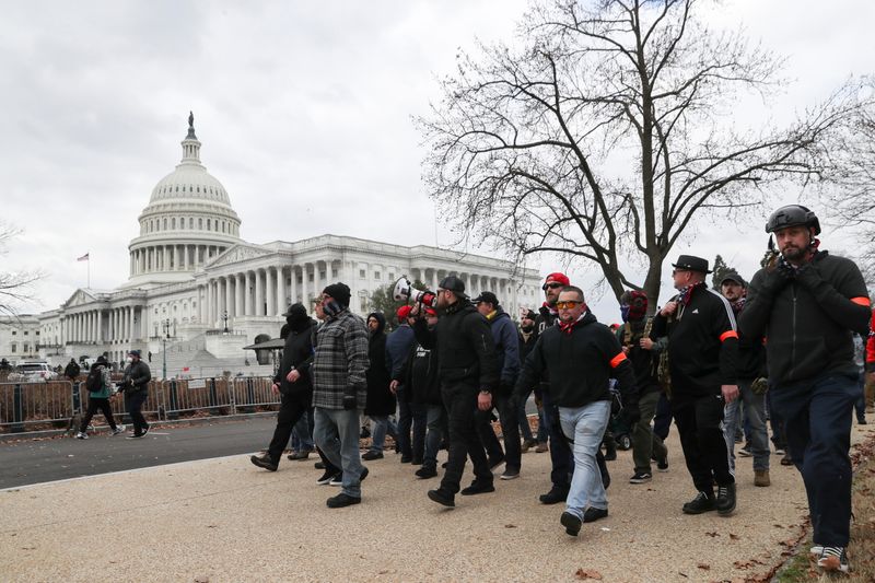 © Reuters. FILE PHOTO: Members of the the far-right group Proud Boys march to the U.S. Capitol Building in Washington, U.S., January 6, 2021. REUTERS/Leah Millis