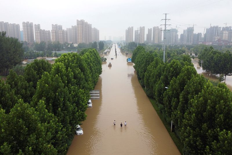 &copy; Reuters. FILE PHOTO: An aerial view shows a flooded road following heavy rainfall in Zhengzhou, Henan province, China July 23, 2021. Picture taken with a drone. REUTERS/Aly Song/File Photo