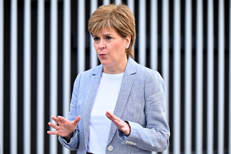 &copy; Reuters. Scottish First Minister Nicola Sturgeon speaks with the media after receiving her second dose of the Oxford/AstraZeneca coronavirus disease (COVID-19) vaccine, administered by staff nurse Susan Inglis at the NHS Louisa Jordan vaccine centre in Glasgow, Sc