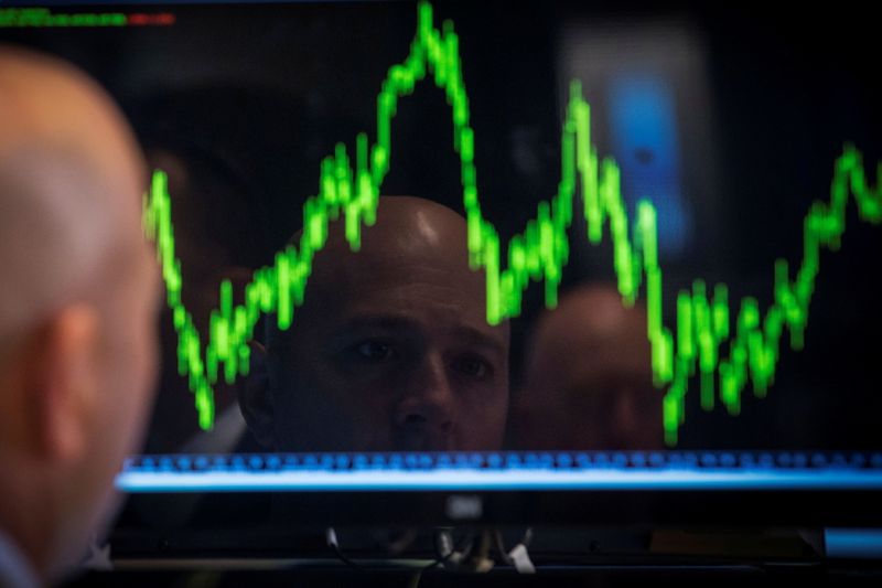 &copy; Reuters. FILE PHOTO: A Specialist trader watches his chart while working on the floor of the New York Stock Exchange July 8, 2014.     REUTERS/Brendan McDermid/File Photo