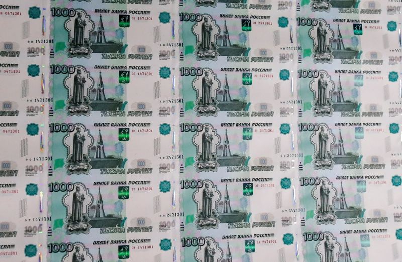 &copy; Reuters. FILE PHOTO: A sheet of 1000 Russian Rouble notes at Goznak printing factory in Moscow, Russia July 11, 2019. REUTERS/Maxim Shemetov/File Photo
