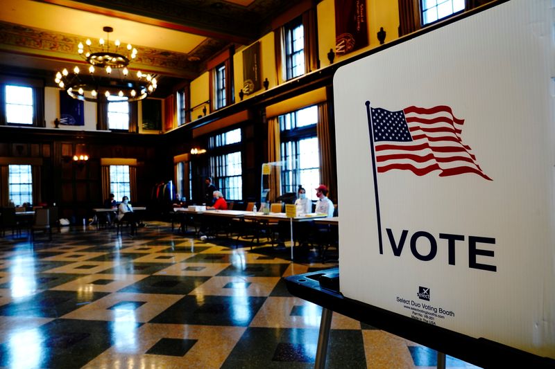 &copy; Reuters. FILE PHOTO: A privacy booth is seen as poll workers wait for voters at a voting site in Tripp Commons inside the Memorial Union building on the University of Wisconsin-Madison campus on Election Day in Madison, Dane County, Wisconsin, U.S. November 3, 202
