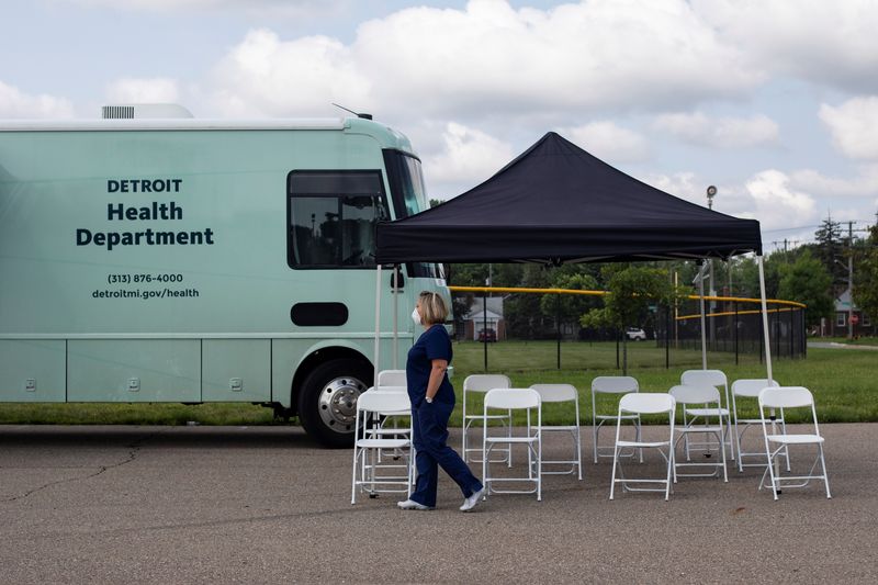 &copy; Reuters. FILE PHOTO: Detroit nurse Hollie Macias walks past an empty waiting area set up for people after receiving their coronavirus disease (COVID-19) vaccines at a mobile pop-up vaccination clinic hosted by the Detroit Health Department with the Detroit Public 