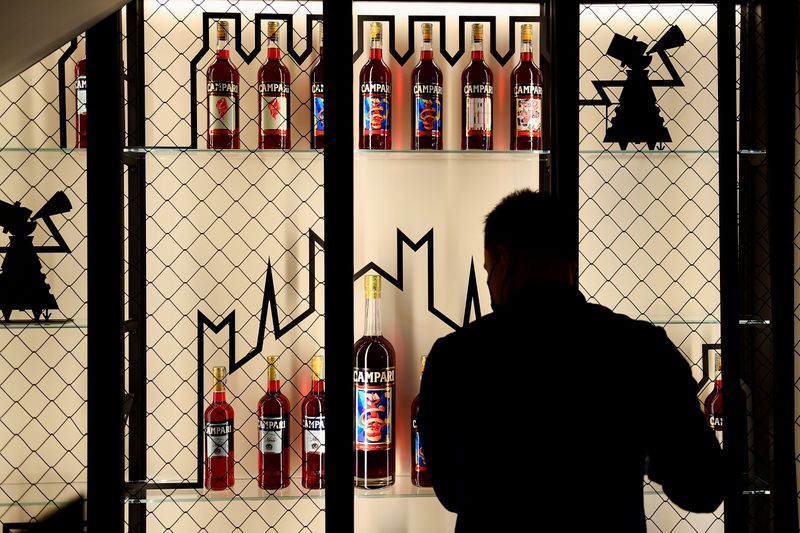 &copy; Reuters. FILE PHOTO: A man is seen near bottles of spirits at the Camparino bar in Milan, Italy July 12, 2021. REUTERS/Flavio Lo Scalzo
