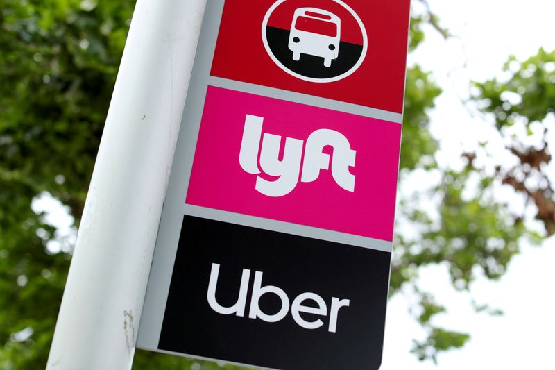 &copy; Reuters. FILE PHOTO: A sign marks a rendezvous location for Lyft and Uber users at San Diego State University in San Diego, California, U.S., May 13, 2020.      REUTERS/Mike Blake