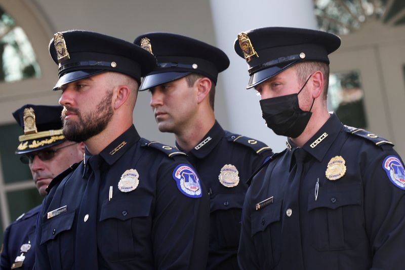 &copy; Reuters. U.S. Capitol Police officers attend as President Joe Biden signs into law an act to award four Congressional Gold Medals to the United States Capitol Police, Washington Metro Police and those who protected the U.S. Capitol on January 6, at the White House