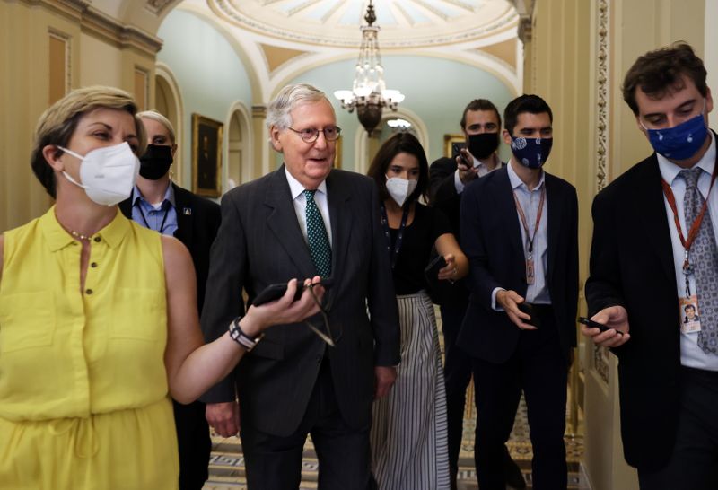 © Reuters. Senate Minority leader Mitch McConnell (R-KY) talks to reporters as he walks to his office at the U.S. Capitol in Washington, U.S., August 5, 2021. REUTERS/Evelyn Hockstein