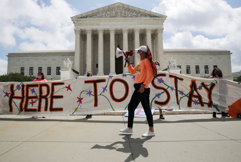 &copy; Reuters. FILE PHOTO: DACA recipients and their supporters celebrate outside the U.S. Supreme Court after the court ruled in a 5-4 vote that U.S. President Donald Trump's 2017 move to rescind the Deferred Action for Childhood Arrivals (DACA) program, created in 201