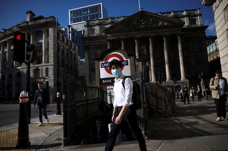 &copy; Reuters. FILE PHOTO: A person walks past Bank underground station during morning rush hour, amid the coronavirus disease (COVID-19) pandemic in London, Britain, July 29, 2021. REUTERS/Henry Nicholls