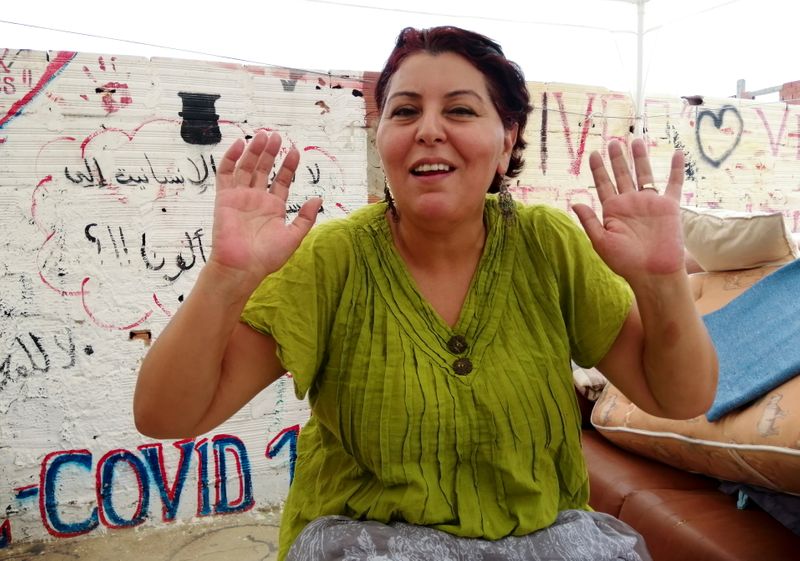 &copy; Reuters. الناشطة السياسية التونسية فاطمة جغام (48 عاما) تتحدث اثناء مقابلة مع رويترز في العاصمة التونسية يوم 3 أغسطس آب 2021. تصوير: جهاد عبد اللاوي - رويت