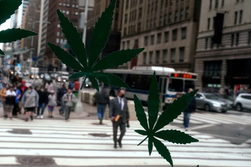 &copy; Reuters. FILE PHOTO: Cannabis stickers on a Weed World store window are pictured the day New York State legalized recreational marijuana use amid the coronavirus disease (COVID-19) pandemic in the Manhattan borough of New York City, New York, U.S., March 31, 2021.