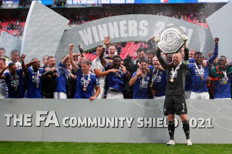 &copy; Reuters. Soccer Football - FA Community Shield - Leicester City v Manchester City - Wembley Stadium, London, Britain - August 7, 2021  Leicester City's Kasper Schmeichel and teammates celebrate with the trophy after winning the FA Community Shield Action Images vi