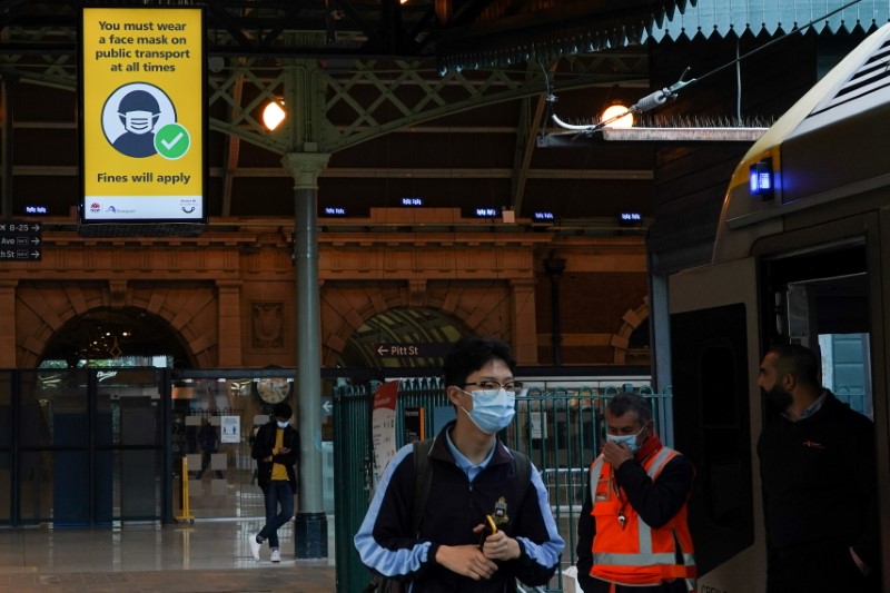 &copy; Reuters. A sign at Central Station notes the implementation of new public health regulations from the state of New South Wales, as the city grapples with an outbreak of the coronavirus disease (COVID-19) in Sydney, Australia, June 23, 2021.  REUTERS/Loren Elliott