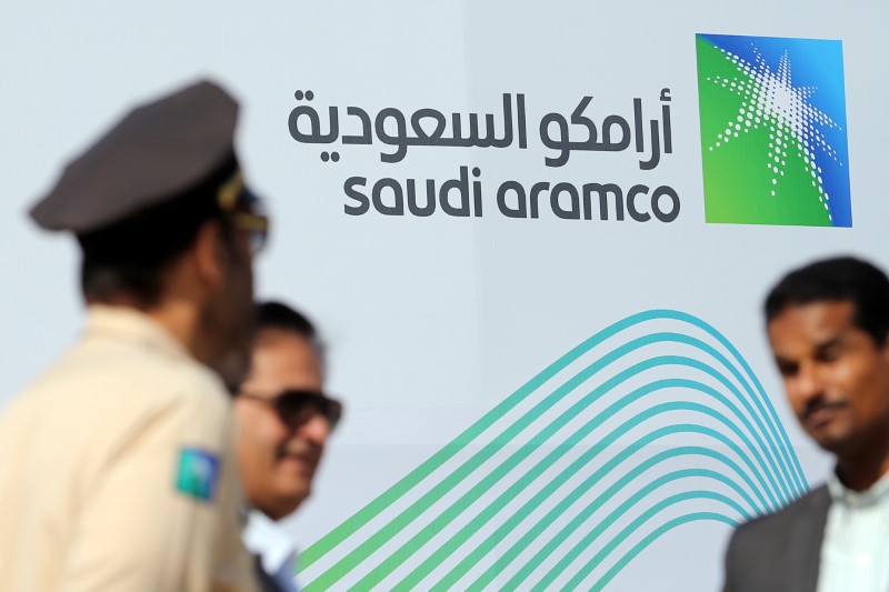 &copy; Reuters. The logo of Aramco is seen as security personnel stand before the start of a press conference by Aramco at the Plaza Conference Center in Dhahran, Saudi Arabia November 3, 2019. REUTERS/Hamad I Mohammed