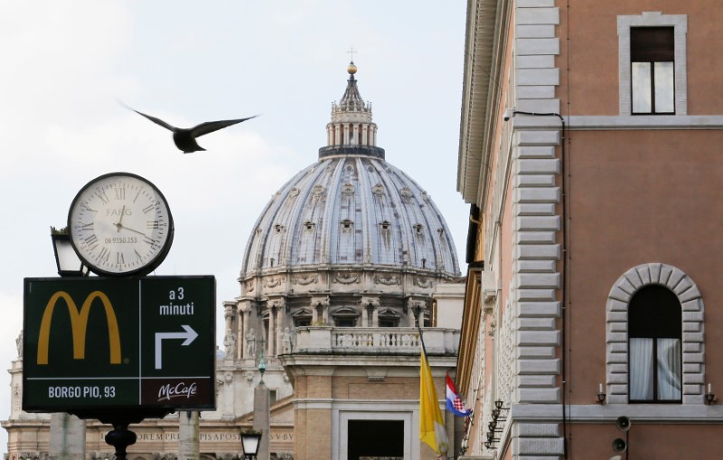 &copy; Reuters. FILE PHOTO: A McDonald's sign is seen at Via della Conciliazione street in Rome, Italy in front of Vatican City's St. Peter's Square January 3, 2017. REUTERS/Alessandro Bianchi