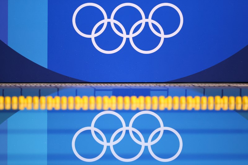 &copy; Reuters. FILE PHOTO: Tokyo 2020 Olympics - Water Polo - Women - Group B - United States v Russian Olympic Committee - Tatsumi Water Polo Centre, Tokyo, Japan - July 30, 2021. The Olympic rings are reflected on the pool. REUTERS/Kacper Pempel