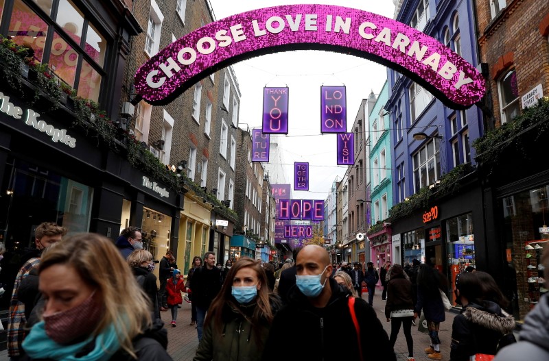 &copy; Reuters. FILE PHOTO: Shoppers are seen on Carnaby street, part of retail landlord Shaftesbury PLC’s property portfolio, amid the coronavirus disease (COVID-19) outbreak in London, Britain, December 12, 2020.  REUTERS/Peter Nicholls/File Photo