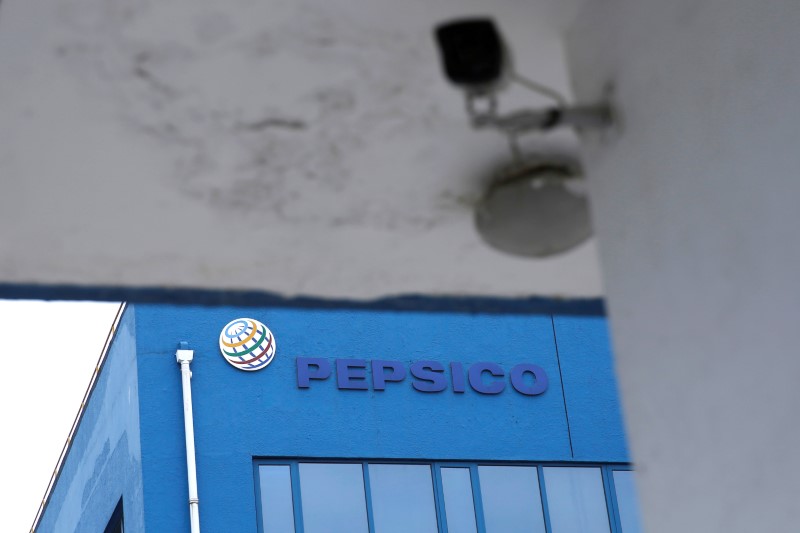 &copy; Reuters. A Pepsico sign is seen at its food-processing plant near a surveillance camera in Beijing's Daxing district, following a new outbreak of the coronavirus disease (COVID-19), China June 22, 2020. REUTERS/Tingshu Wang