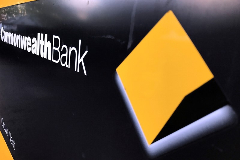 &copy; Reuters. FILE PHOTO: A Commonwealth Bank of Australia logo adorns the wall of a branch in Sydney, Australia, May 8, 2017. REUTERS/David Gray