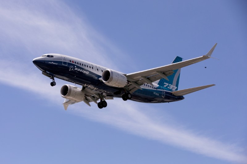 © Reuters. FILE PHOTO: A Boeing 737 MAX airplane lands after a test flight at Boeing Field in Seattle, Washington, U.S. June 29, 2020. REUTERS/Karen Ducey//File Photo