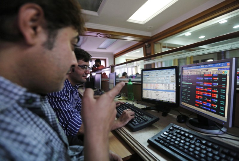 &copy; Reuters. FILE PHOTO:  Brokers trade at their computer terminals at a stock brokerage firm in Mumbai January 6, 2015.  REUTERS/Shailesh Andrade/File photo 