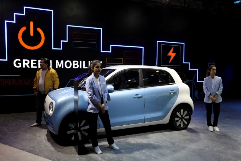&copy; Reuters. FILE PHOTO: Models pose next to Great Wall Motors (GWM) GWM R1 electric car at its pavilion at the India Auto Expo 2020 in Greater Noida, India, February 5, 2020. REUTERS/Anushree Fadnavis/File Photo