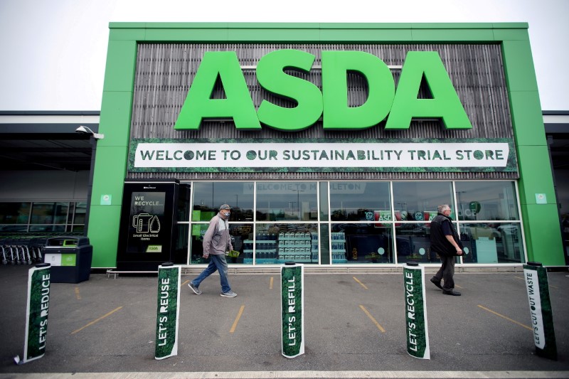 &copy; Reuters. FILE PHOTO: Shoppers walk past the UK supermarket Asda, in Leeds, Britain, October 19, 2020. REUTERS/Molly Darlington/File Photo