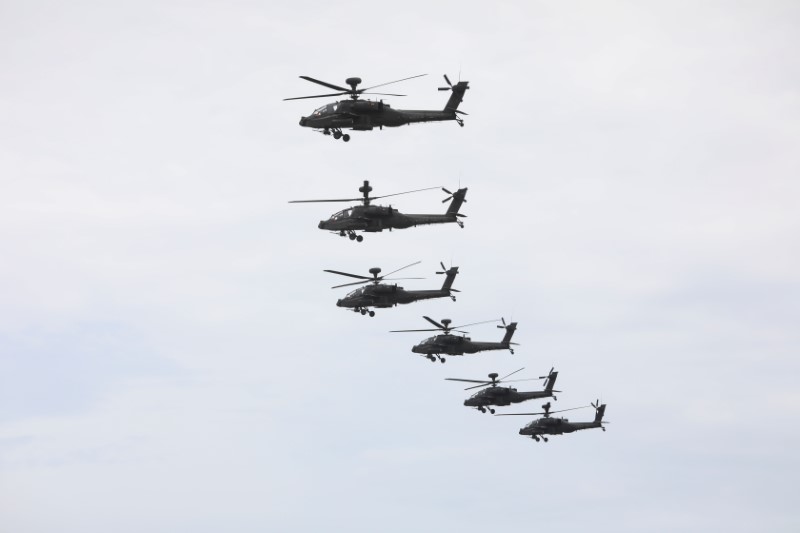 &copy; Reuters. FILE PHOTO: AH-64 Apache helicopters fly to location during the live-fire, anti-landing Han Kuang military exercise, which simulates an enemy invasion, in Taichung, Taiwan July 16, 2020. REUTERS/Ann Wang