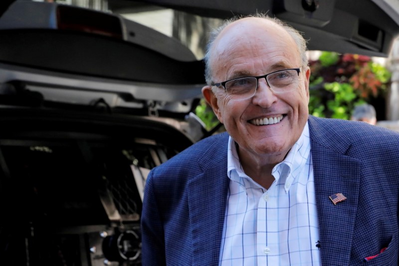 &copy; Reuters. FILE PHOTO: Former New York City Mayor Rudy Giuliani is seen outside his apartment building after his law license was suspended in Manhattan in New York City, New York, U.S., June 24, 2021. REUTERS/Andrew Kelly