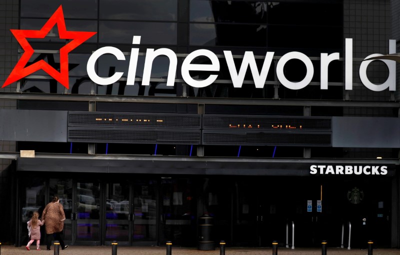&copy; Reuters. FILE PHOTO: People enter a Cineworld cinema following the outbreak of the coronavirus disease near Manchester, Britain, October 4, 2020. REUTERS/Phil Noble/File Photo/File Photo/File Photo