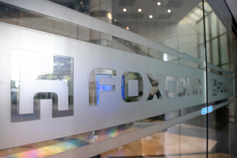 &copy; Reuters. A sign of Foxconn is seen at a glass door inside its office building in Taipei, Taiwan November 12, 2020. REUTERS/Ann Wang