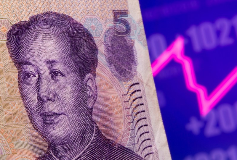 &copy; Reuters. A Chinese Yuan banknote is seen in front of displayed stock graph in this illustration taken May 7, 2021. REUTERS/Dado Ruvic/Illustration