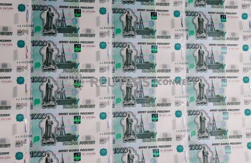 &copy; Reuters. FILE PHOTO: A sheet of 1000 Russian Rouble notes at Goznak printing factory in Moscow, Russia July 11, 2019. REUTERS/Maxim Shemetov/File Photo