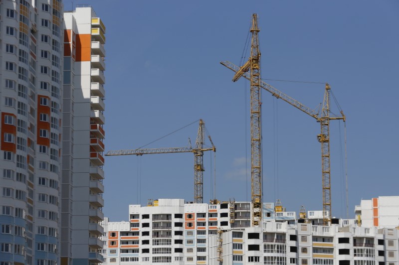 &copy; Reuters. Construction cranes are seen on top of residential buildings under construction at Russian real estate developer PIK Group's construction site in Mytischi outside Moscow, Russia, June 3, 2015. REUTERS/Maxim Shemetov