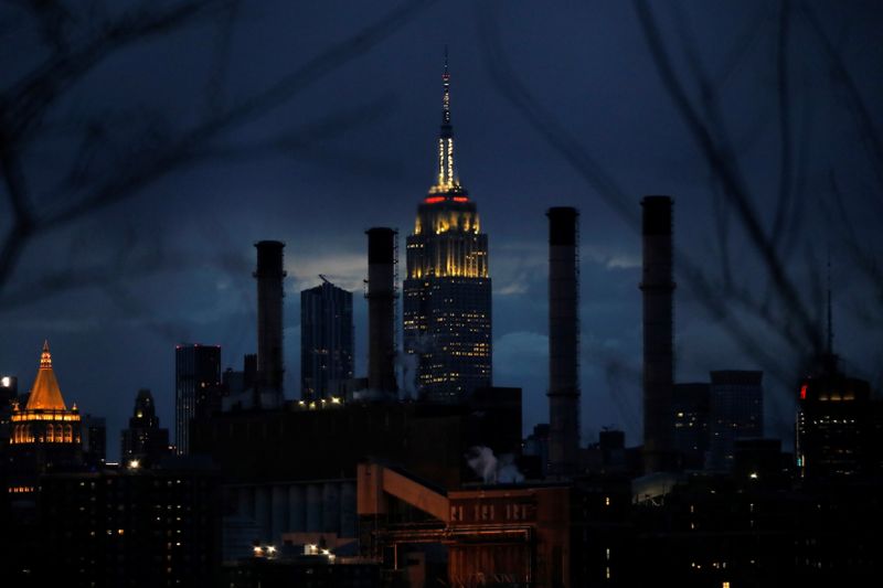&copy; Reuters. FILE PHOTO: The Empire State Building is illuminated behind the Con Edison Power Plant in Manhattan, New York City, New York, U.S., April 22, 2021. REUTERS/Andrew Kelly