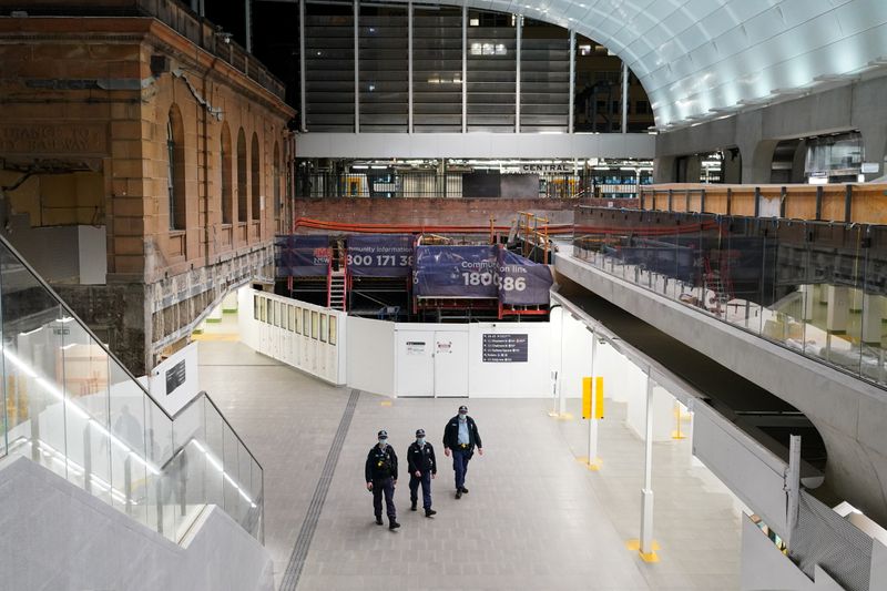 &copy; Reuters. Police officers patrol through the quiet Central Station in the city centre during a lockdown to curb the spread of a coronavirus disease (COVID-19) outbreak in Sydney, Australia, August 12, 2021.  REUTERS/Loren Elliott